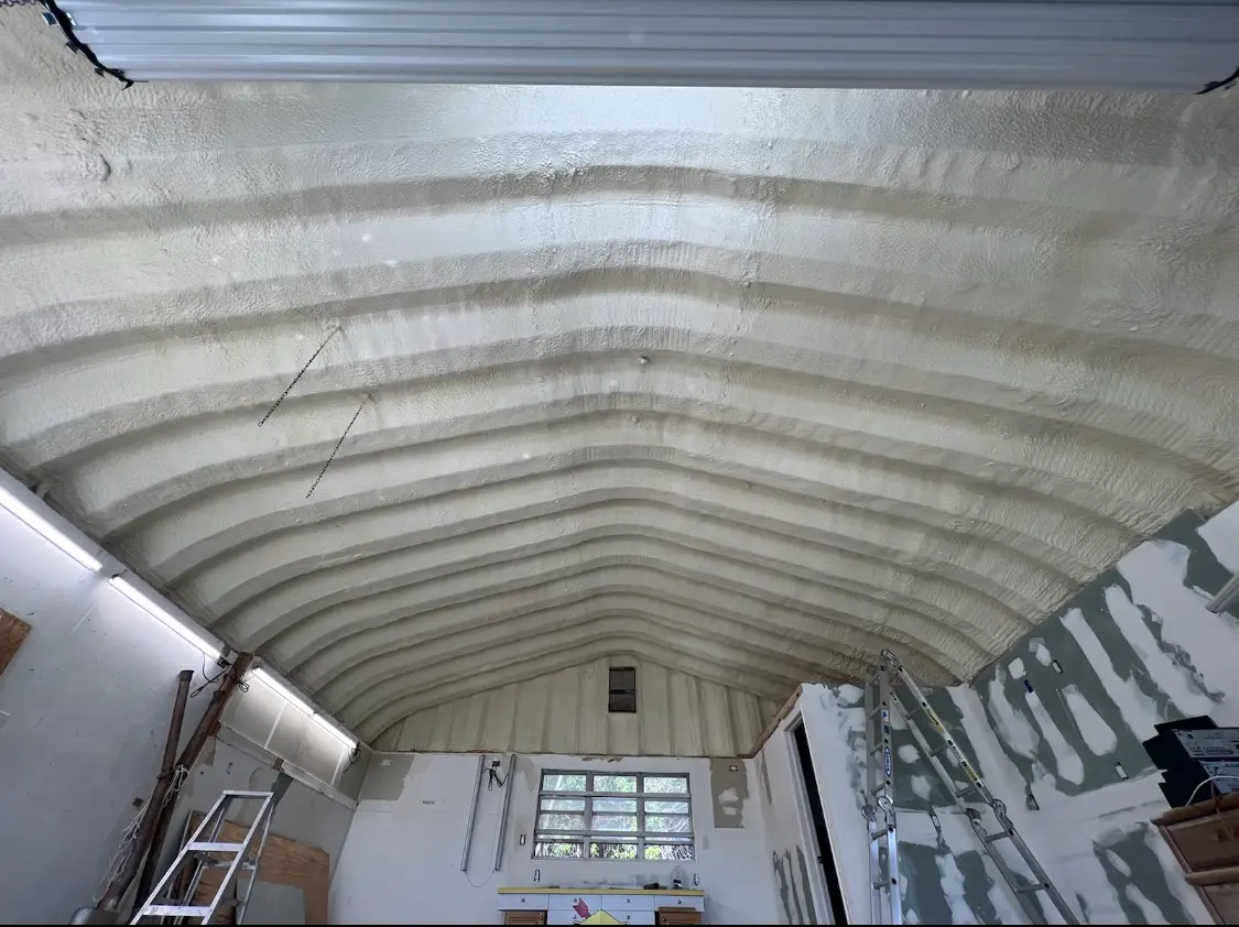 Spray polyurethane foam applied to the underside of a metal roof deck in Bridgetown